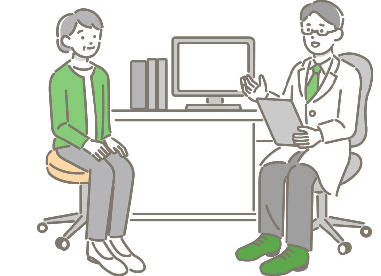 診察を行う医師と女性の患者のイラスト